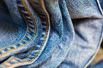 Image showing aged Jeans with yellow stitching thread