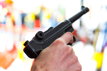 Image showing Parabellum automatic pistol in a human hand