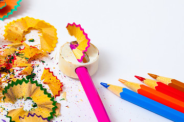 Image showing colored pencils, sharpener and shavings