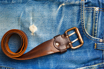 Image showing vintage leather belt on old jeans