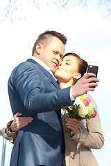 Image showing beautiful bride and groom make selfie