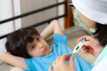 Image showing Temperature measurement in the child. home medicine