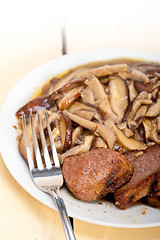 Image showing venison deer game filet and wild mushrooms