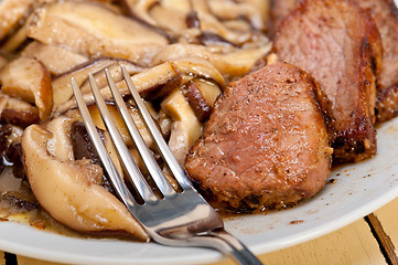 Image showing venison deer game filet and wild mushrooms