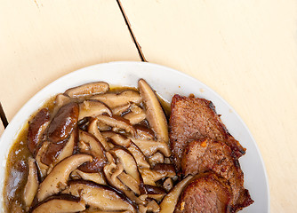 Image showing venison deer game filet and wild mushrooms