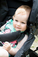 Image showing Cute White Blond Baby girl on Stroller