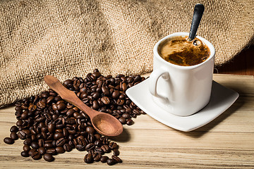 Image showing pile of fresh beans, cap, and spoon