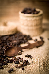 Image showing pile of fresh and bio aromatic coffee beans and spoon