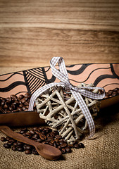 Image showing pile of fresh coffee beans, heart and spoon