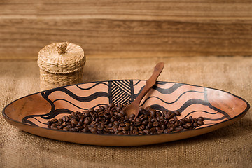 Image showing pile of fresh and bio aromatic coffee beans and spoon