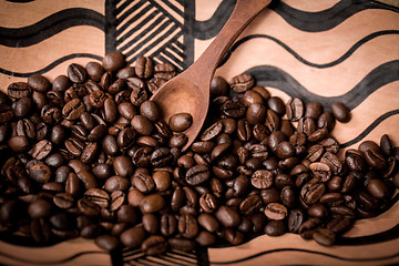 Image showing pile of fresh and bio aromatic coffee beans and spoon