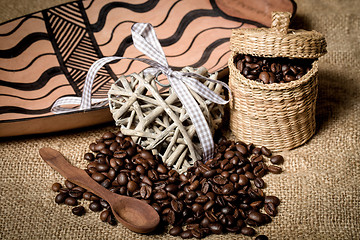 Image showing pile of fresh coffee beans, heart and spoon