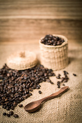 Image showing pile of fresh and bio aromatic coffee beans and spoon