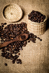 Image showing pile of fresh and bio aromatic coffee beans and spoon