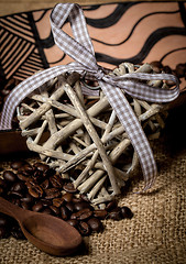 Image showing pile of fresh coffee beans, heart and spoon