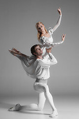 Image showing Two young ballet dancers practicing. attractive dancing performers  in white 