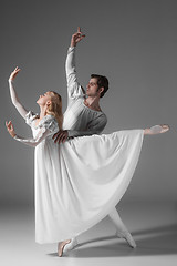 Image showing Two young ballet dancers practicing. attractive dancing performers  in white 