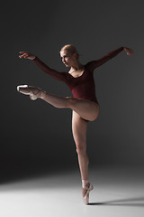 Image showing Young beautiful modern style dancer posing on a studio background