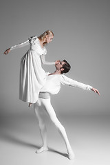 Image showing Two young ballet dancers practicing. attractive dancing performers  in white 