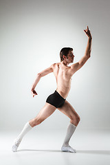 Image showing The young attractive modern ballet dancer on white background