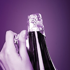 Image showing Opening champagne bottle