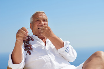 Image showing senior man sitting outside