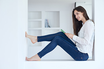 Image showing woman at home using tablet