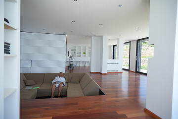 Image showing Portrait of senior man relaxing in sofa