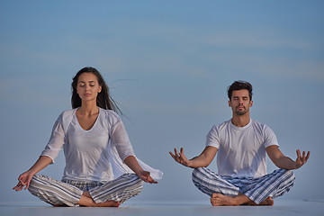 Image showing young couple practicing yoga