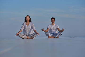 Image showing young couple practicing yoga