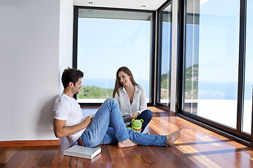 Image showing relaxed young couple at home staircase