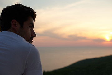 Image showing relaxed young man at home on balcony