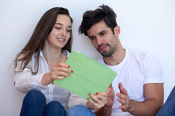 Image showing couple at modern home using tablet computer