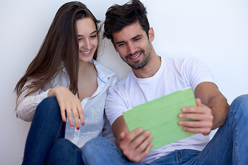 Image showing couple at modern home using tablet computer