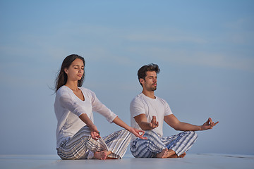 Image showing young couple practicing yoga