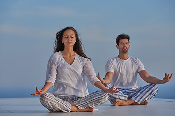 Image showing young couple practicing yoga