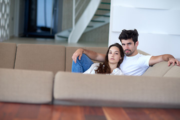 Image showing relaxed young couple at home staircase