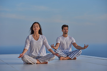 Image showing young couple practicing yoga