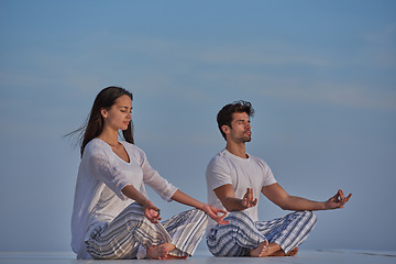 Image showing young couple practicing yoga