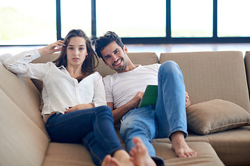 Image showing couple at modern home using tablet computer