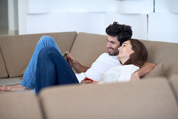 Image showing couple at modern home using tablet computer