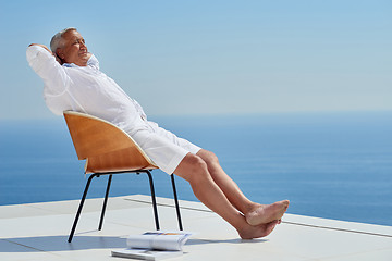 Image showing senior man sitting outside