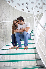 Image showing relaxed yung couple at home  stairs