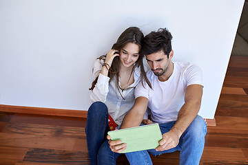 Image showing couple at modern home using tablet computer