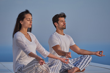 Image showing young couple practicing yoga