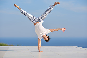 Image showing young man practicing yoga