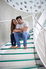 Image showing relaxed yung couple at home  stairs