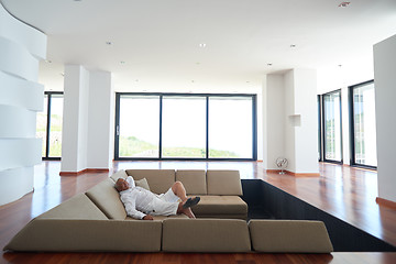 Image showing Portrait of senior man relaxing in sofa