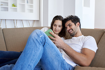 Image showing couple at modern home using tablet computer