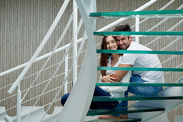 Image showing relaxed yung couple at home  stairs